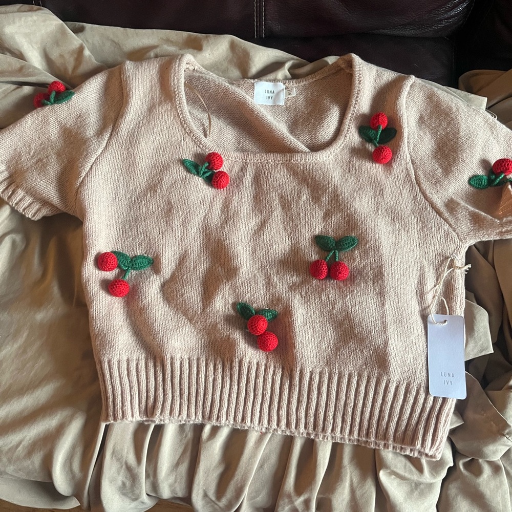 Cream Sweater with Red Accents
